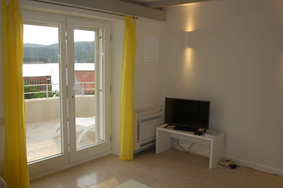 The main entrance lets in lots of light but also has outer shutters