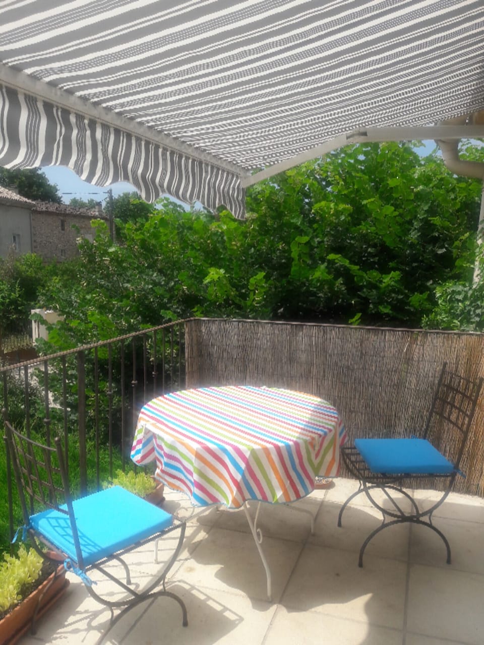 Sunny balcony with village views and sunshade
