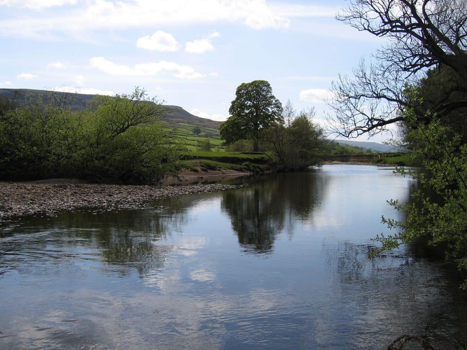 Our River boundary with seats by the water edge, sit, paddle or swim