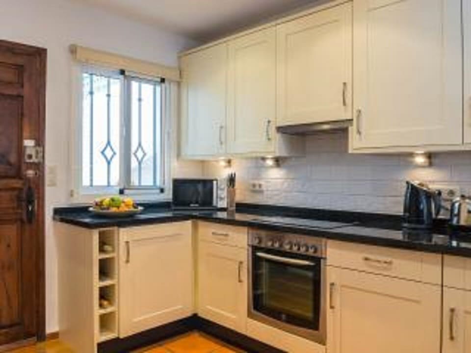 Open plan well equipped kitchen.