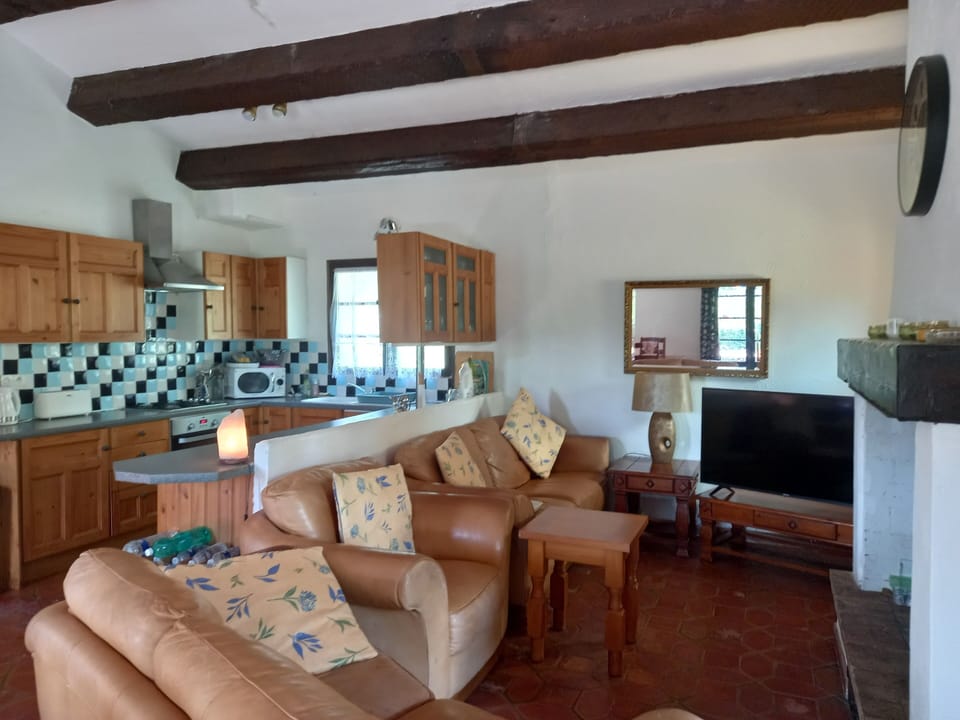 Beamed living area three seater two seater and armchair. Smart internet TV