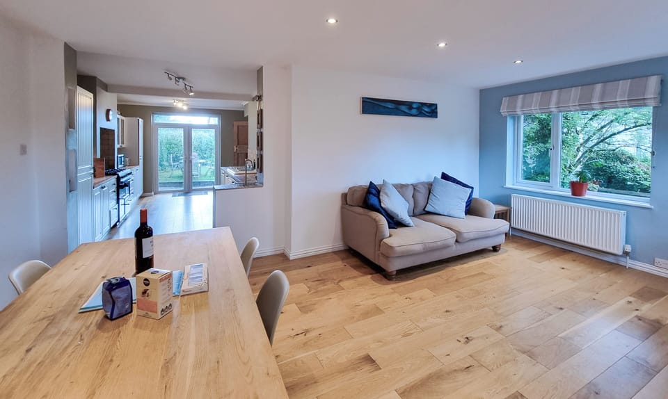 Open plan living area with 2 & 3 seat sofas +dining table 6 chairs & sky sports