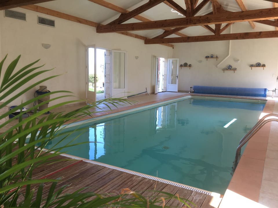 Beautiful heated indoor pool with jacuzzi hot tub to the side (not in photo)