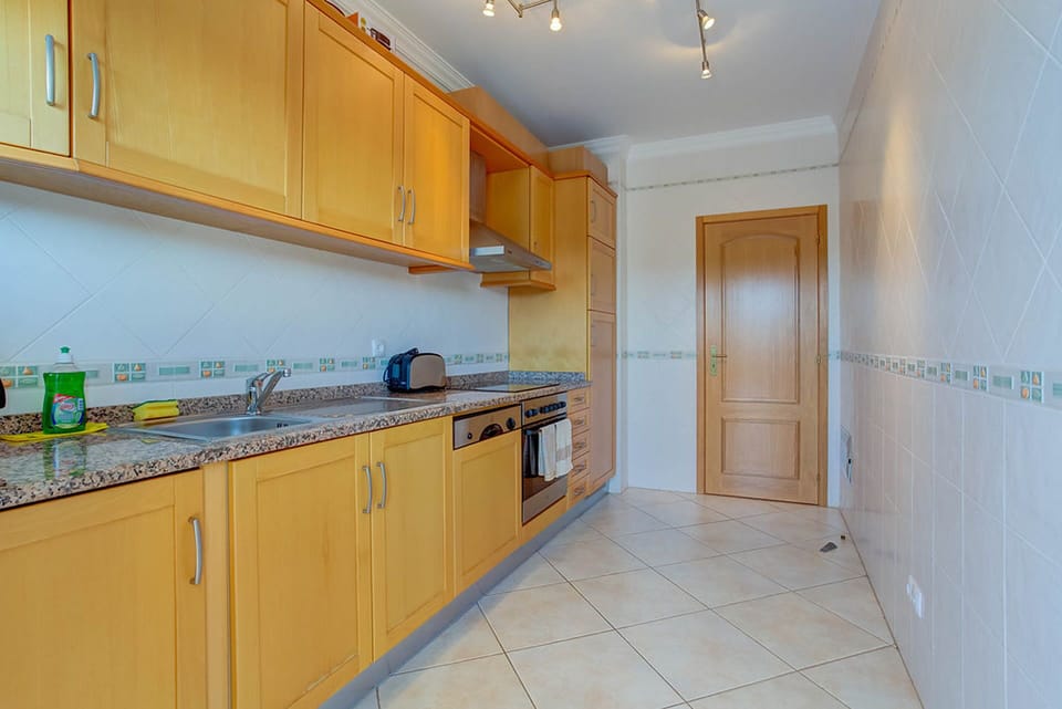 Fitted kitchen is modern and well equipped