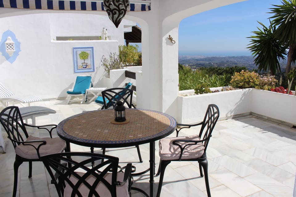 Large terrace wraps around the apartment. Two dining areas and sunbathing  space