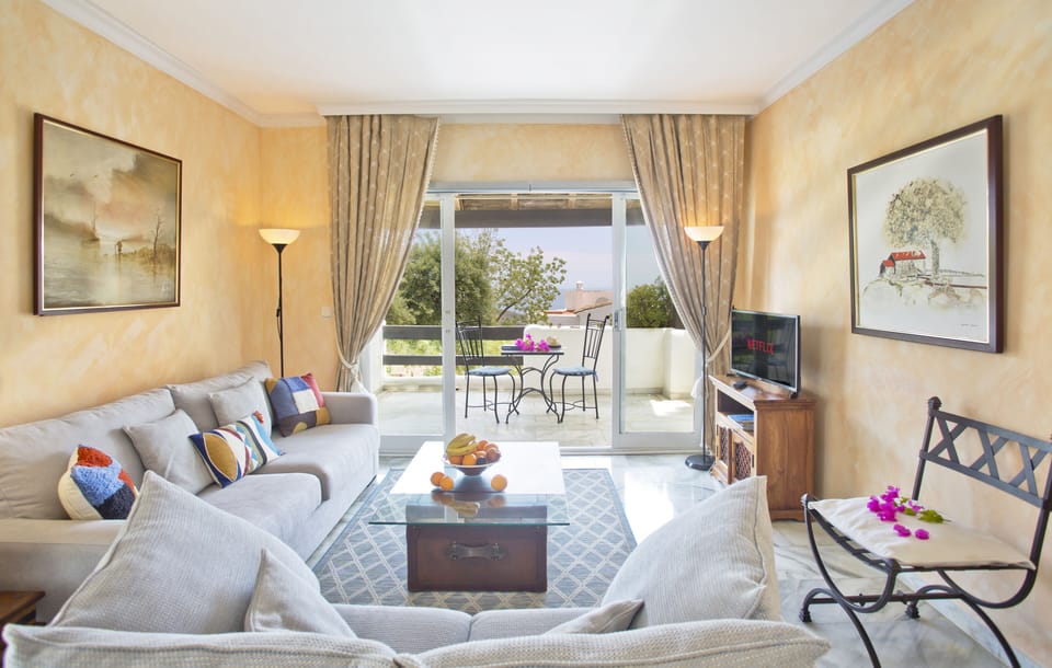 The view south from the sitting room, past the terrace to the sea beyond