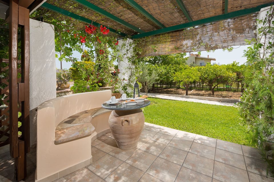 balcony with stoned table and garden view