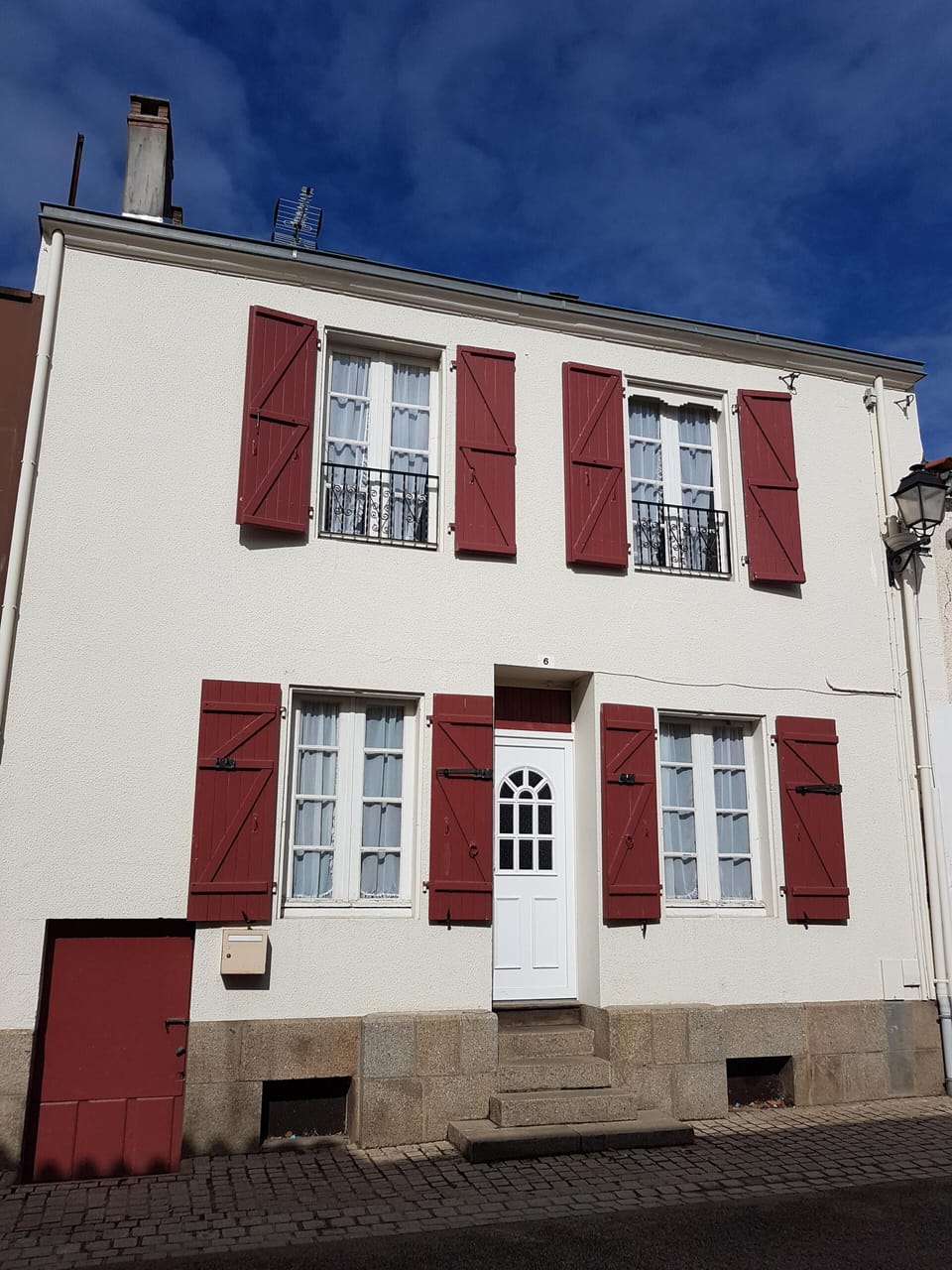 red shutters holiday home