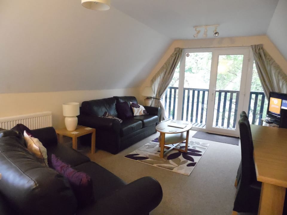 Lounge/ Dinning area with doors to balcony