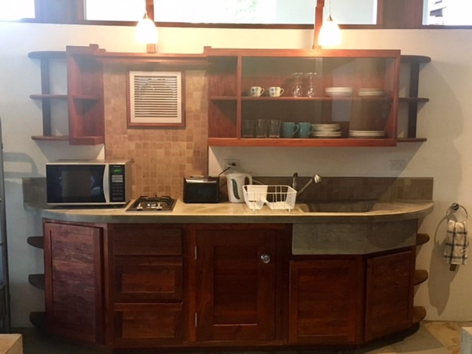 Timber kitchen. microwave, Cooktop,crockery, glasses, toaster, kettle