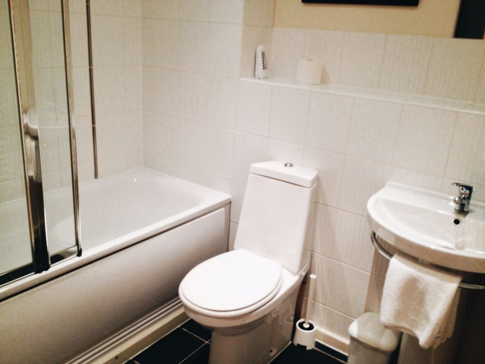 Family bathroom - bath with a shower over and a separate shower cubical.