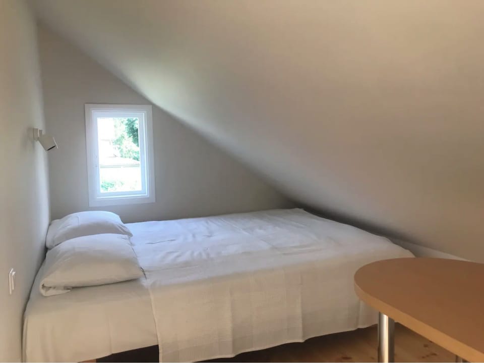 1# room with double bed & sofa with a private bathroom. The room is light.