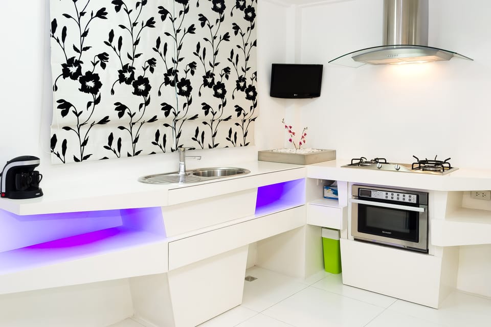 Our Beautiful Kitchen seen from our Dinning Table with a mini Plasma TV to even watch your best shows.