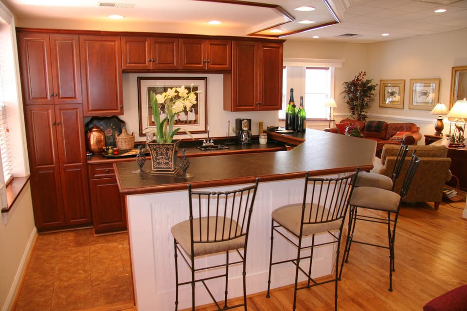Custom walk behind bar for entertaining. Has separate wine/beer fridge.