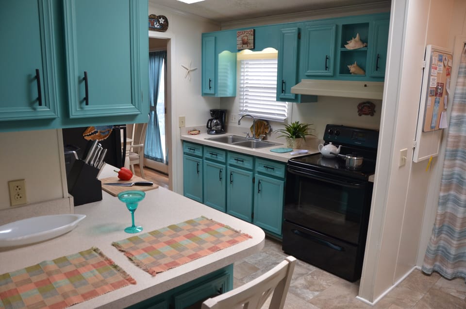 Kitchen: coffee maker, blender, toaster oven, microwave, dishwasher and laundry.