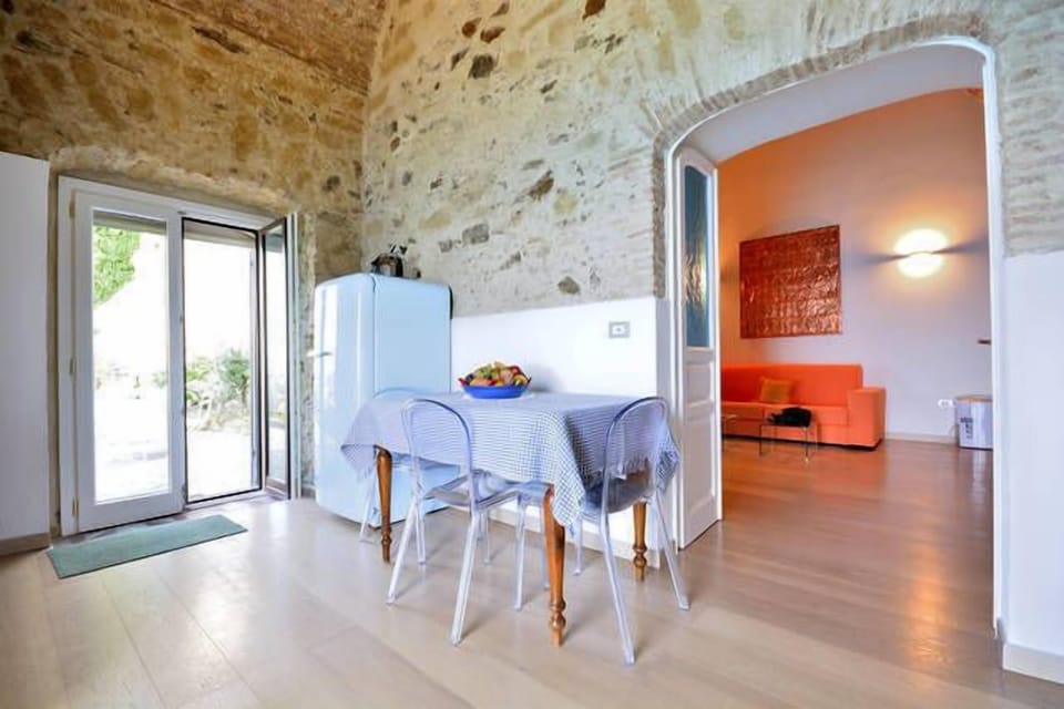 living and dining with access to the private terrace