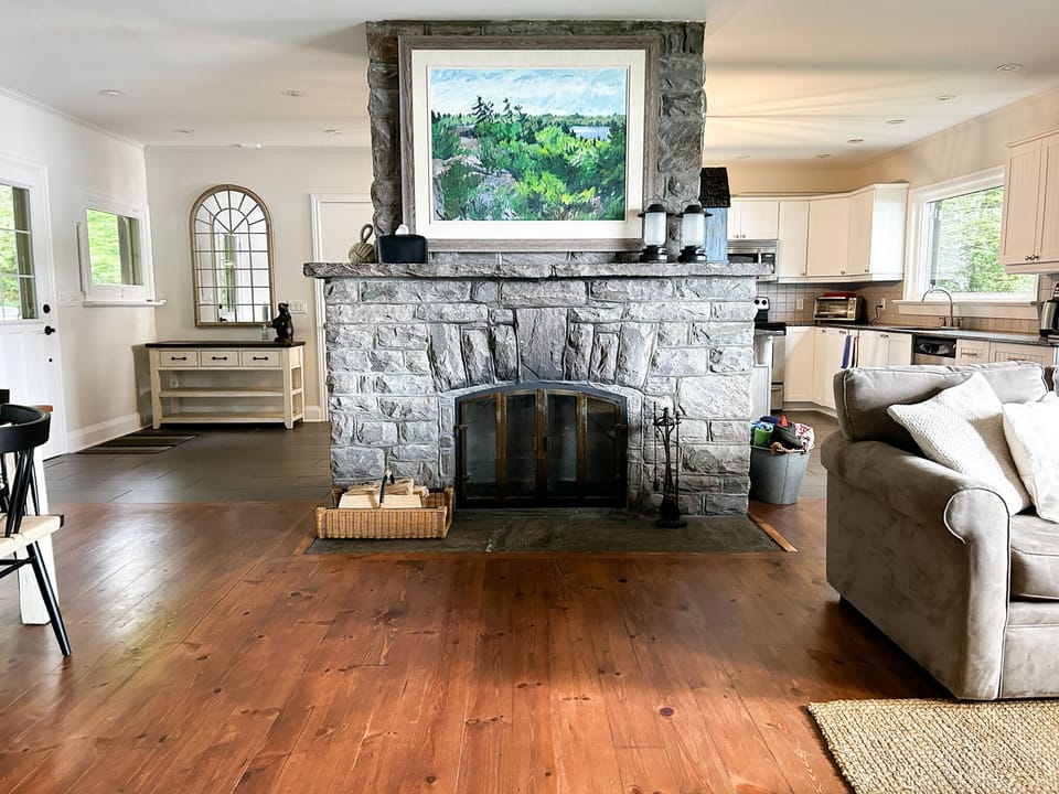 The fireplace was built with local Muskoka granite from the area. 

