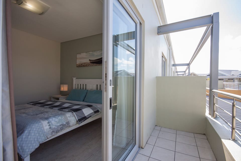 Main bedroom with sliding doors to balcony