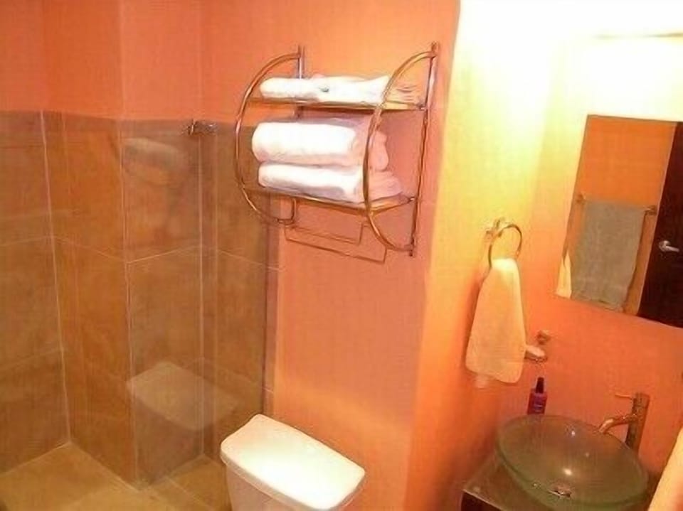 Newly remodeled bathroom with large walk in shower with bench seating