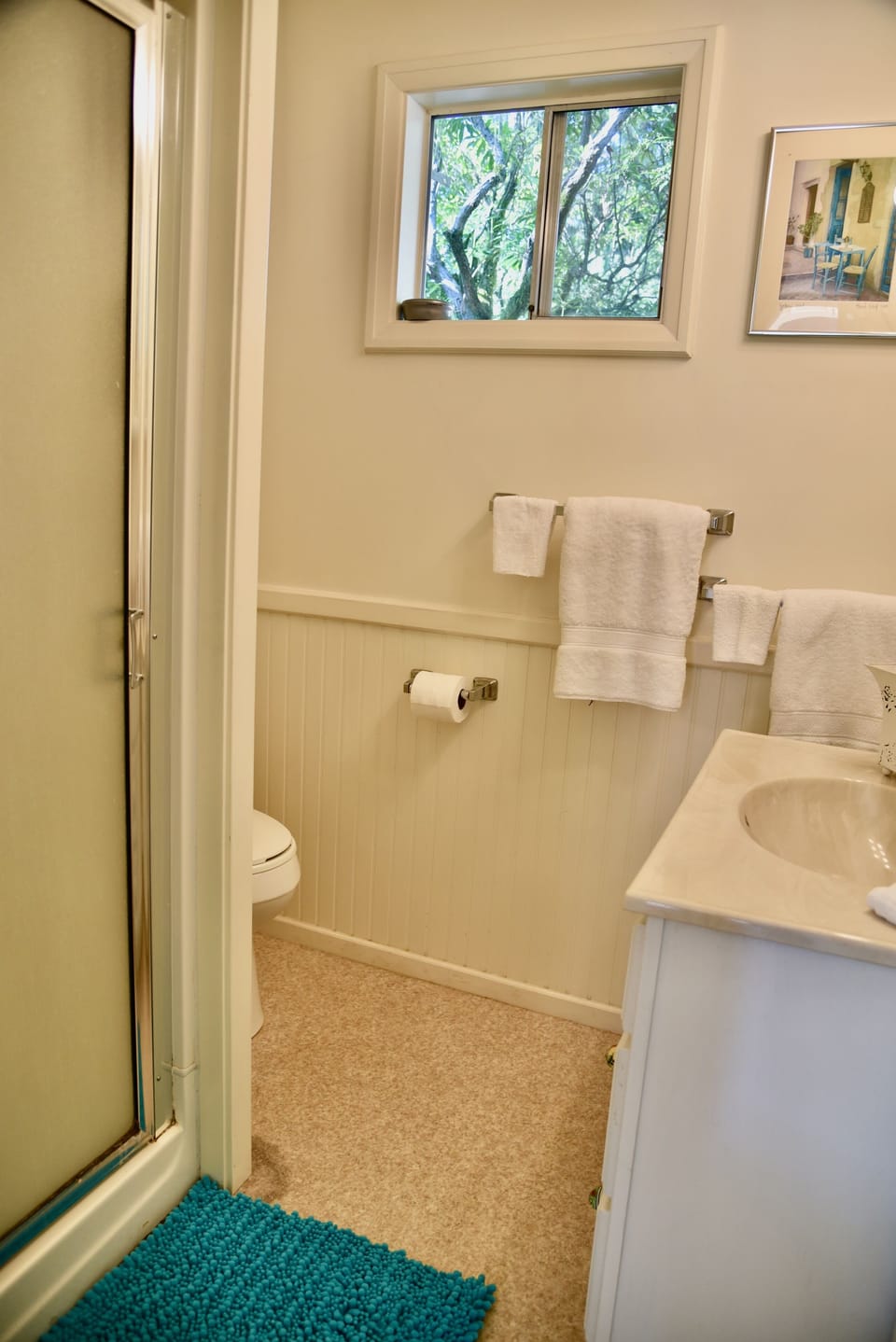 The bathroom has a standing shower for cleaning up after a long day at the river