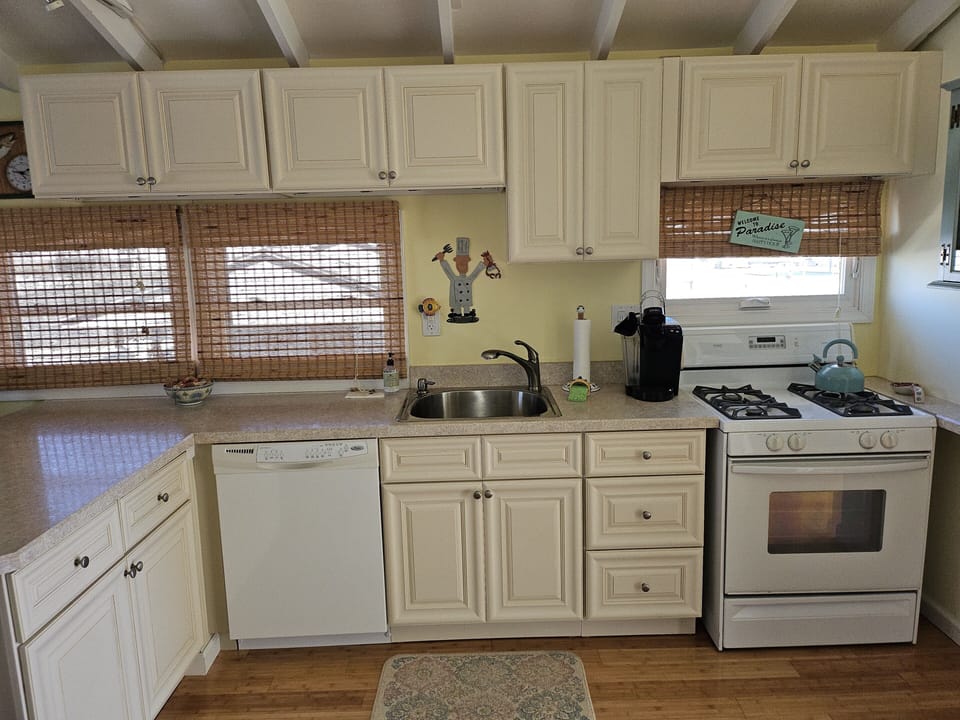 Kitchen with dishwasher, full size range and refrigerator/freezer with ice maker