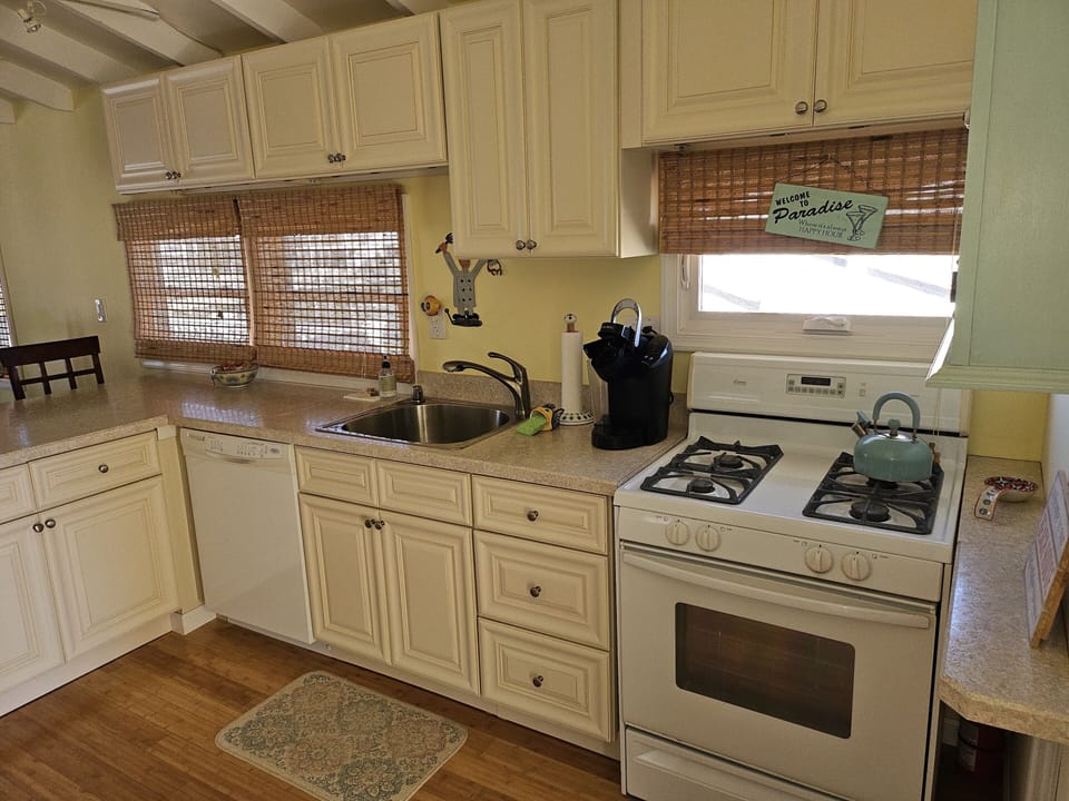 Kitchen with dishwasher, full size range and refrigerator/freezer with ice maker