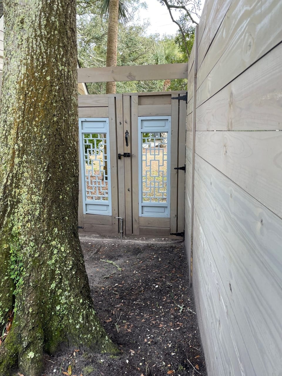 Fully fenced with gates at both sides of the house.