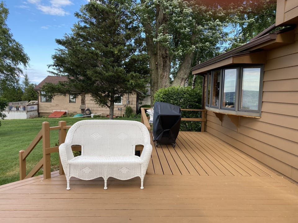 Front deck overlooking the lake with gas grill