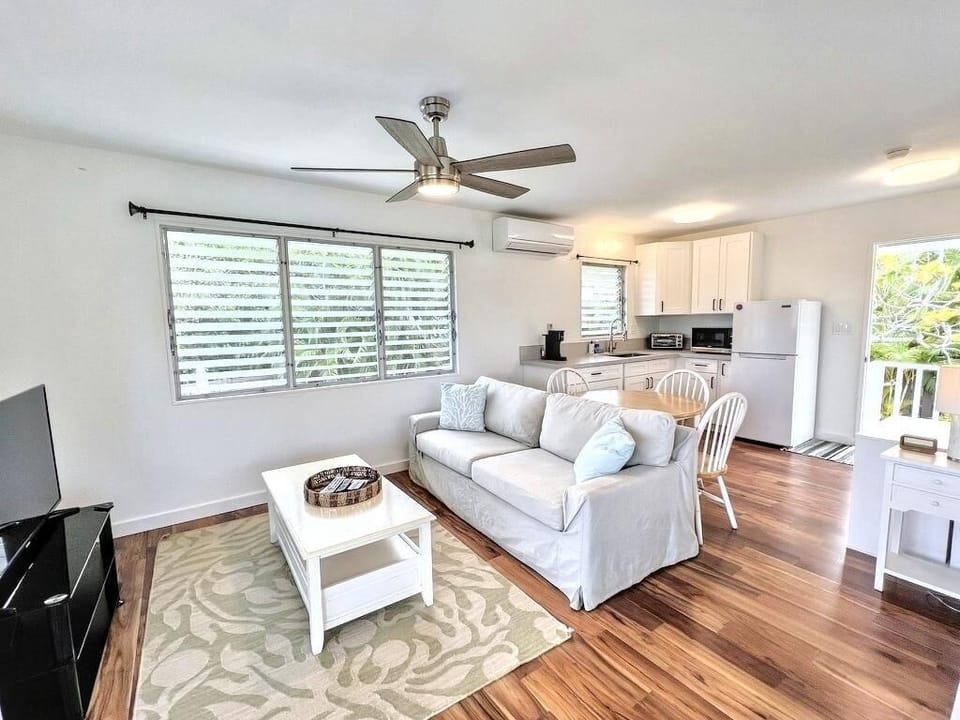 Unwind in the guest cottage sitting area, featuring cozy furnishings and new split air conditioning.