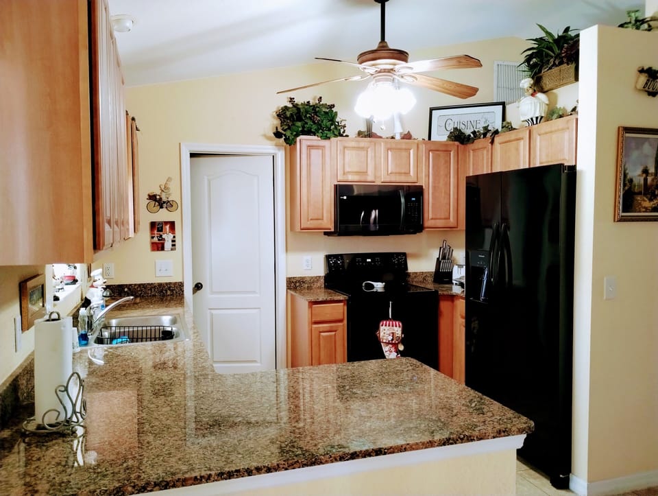 Brand new side by side refrigerator, stove, and microwave added in January 2024.