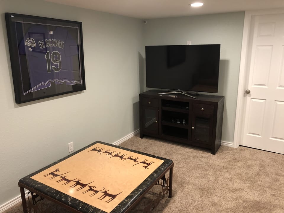 Basement with full bath, 3rd bedroom, and laundry.