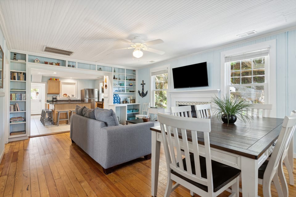 The home offers plenty of space, with each floor featuring a living room, dining room and kitchen. (Upper floor pictured here.)