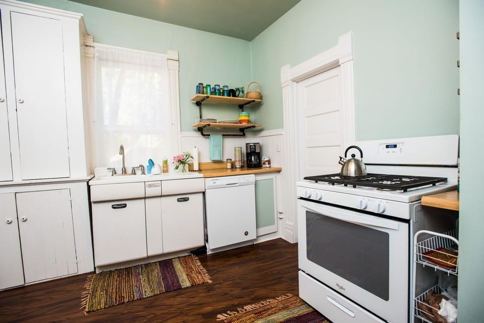 Sweet kitchen with 1950's sink and new dishwasher and gas stove.