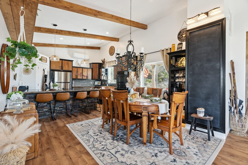 Kitchen with island seating, dining table, Coffee bar, and window seat.