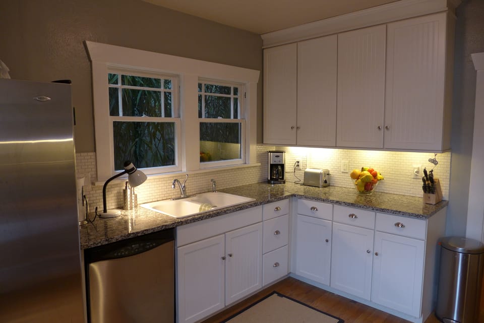 Kitchen with complete selection of appliances, cookware and service for 12.