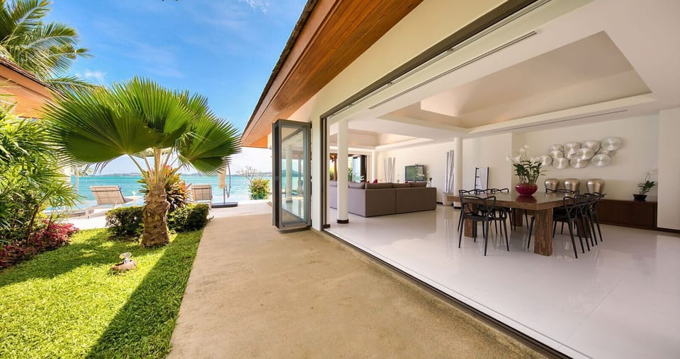 A dining pavilion with full length folding doors which is linked to the kitchen.