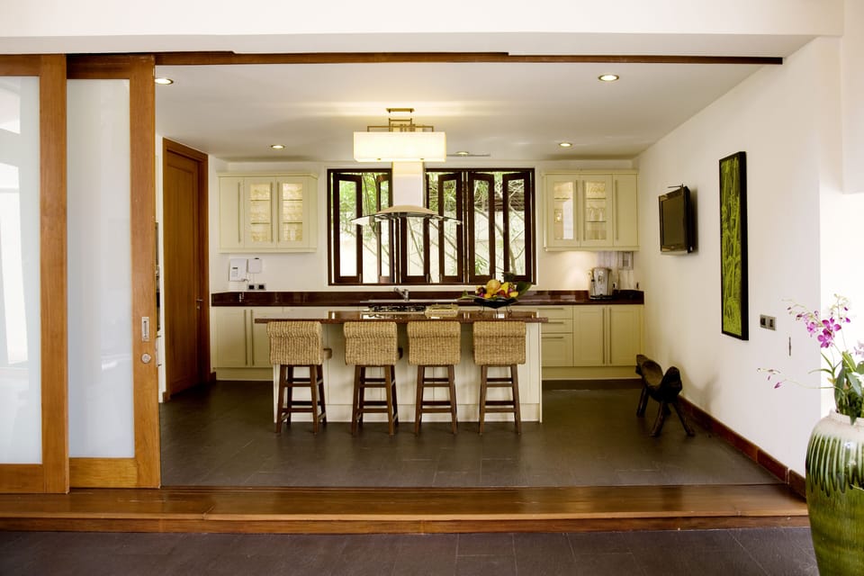 Well-equipped kitchen with stove top, oven, coffee machine, and more