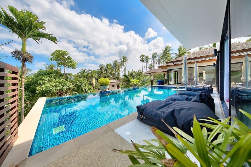 12m infinity pool with shallow area for children and 4 bean bags with umbrellas