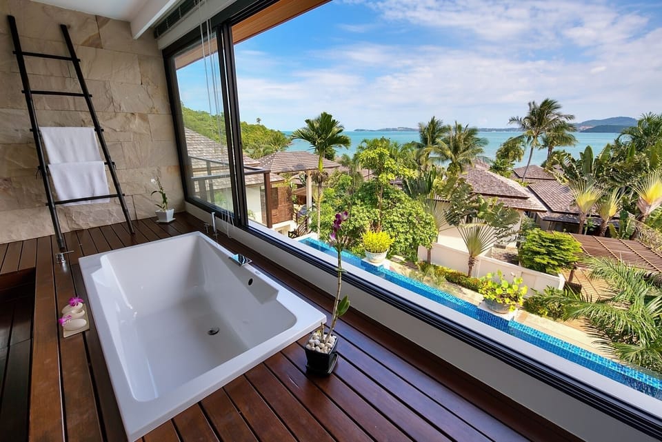 En-suite bathroom with single vanity overlooking the pool