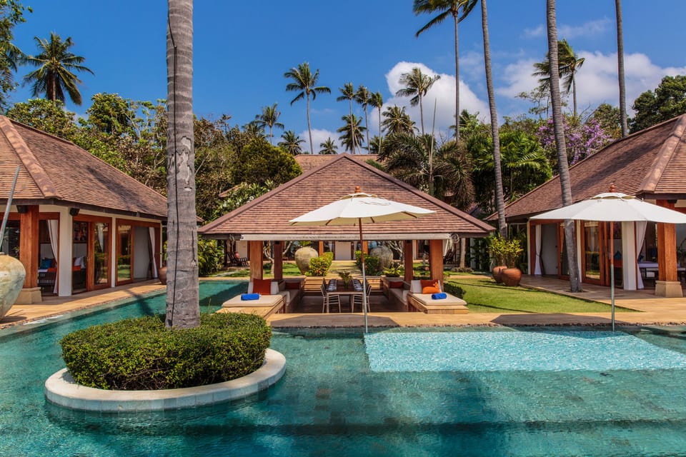 This villa features a T-shaped pool surrounding a pavilion