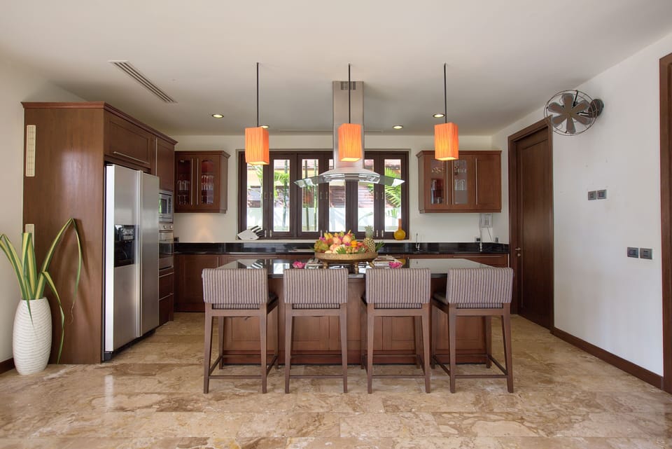 Well-equipped kitchen with stove top, oven, coffee machine, and more