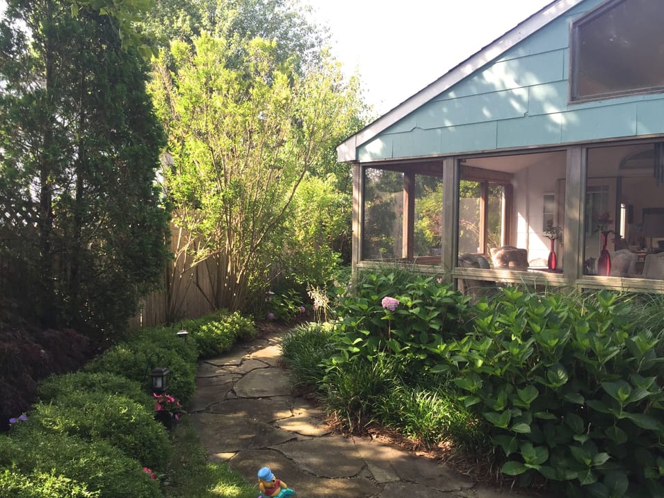 Screened porch, bluestone path, side garden leading to backyard