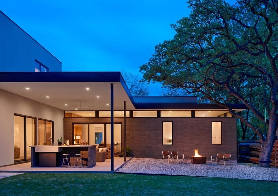 Backyard - covered patio, couches, island, gas fire pit