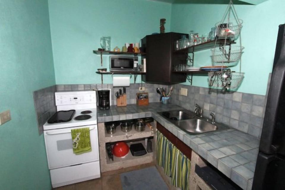 The kitchen area has everything you need to cook a meal at home.
