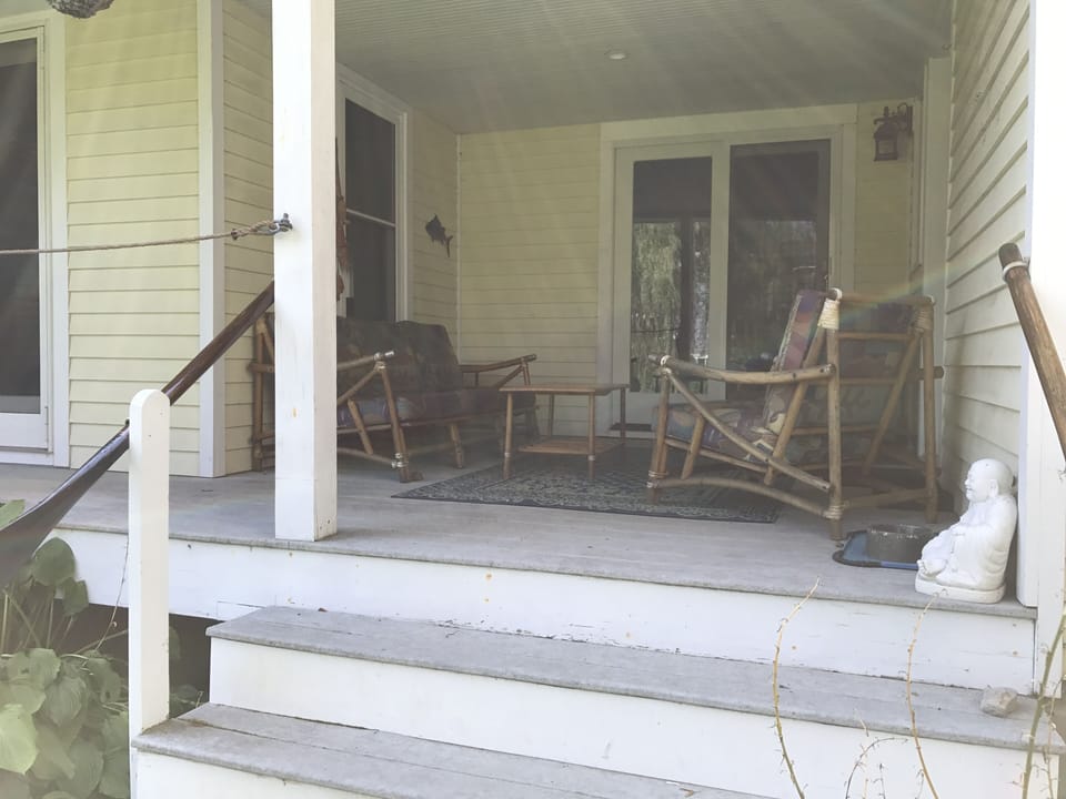 Comfortable seating on back deck, a favorite spot for reading and relaxing.