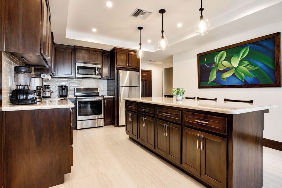 Kitchen includes an 8 foot island with four barstools.