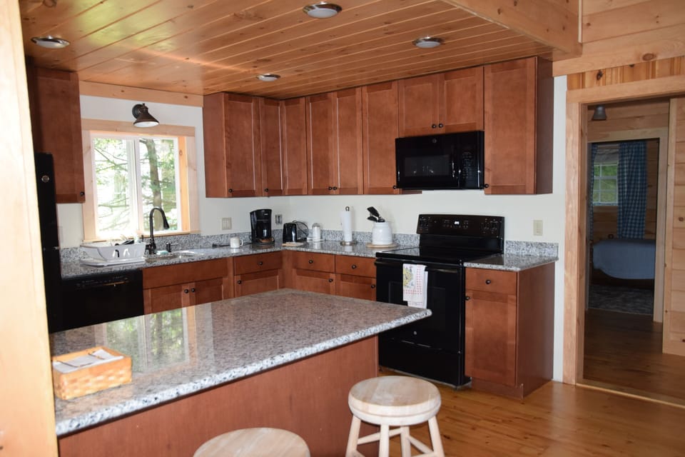 New kitchen with granite counters.