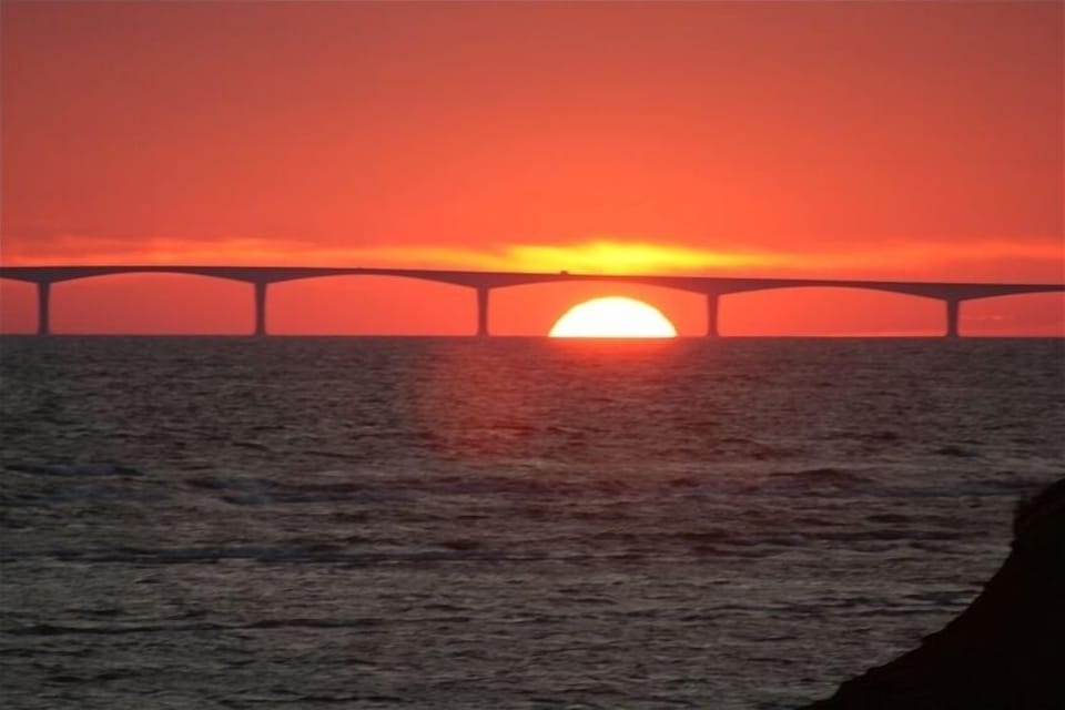 Sun setting under the Confederation Bridge
