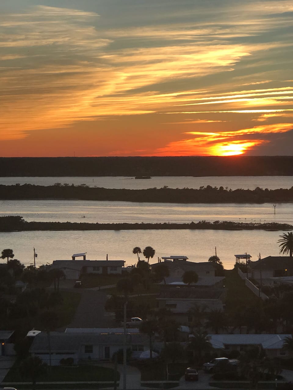 Sunset on the River from unit entrance and guest room.