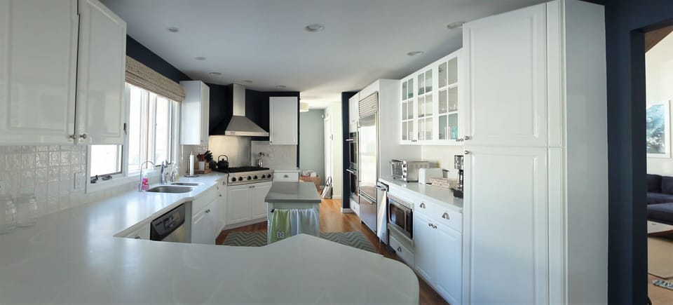 Fully-stocked kitchen with Subzero fridge, Viking stove top and double oven
